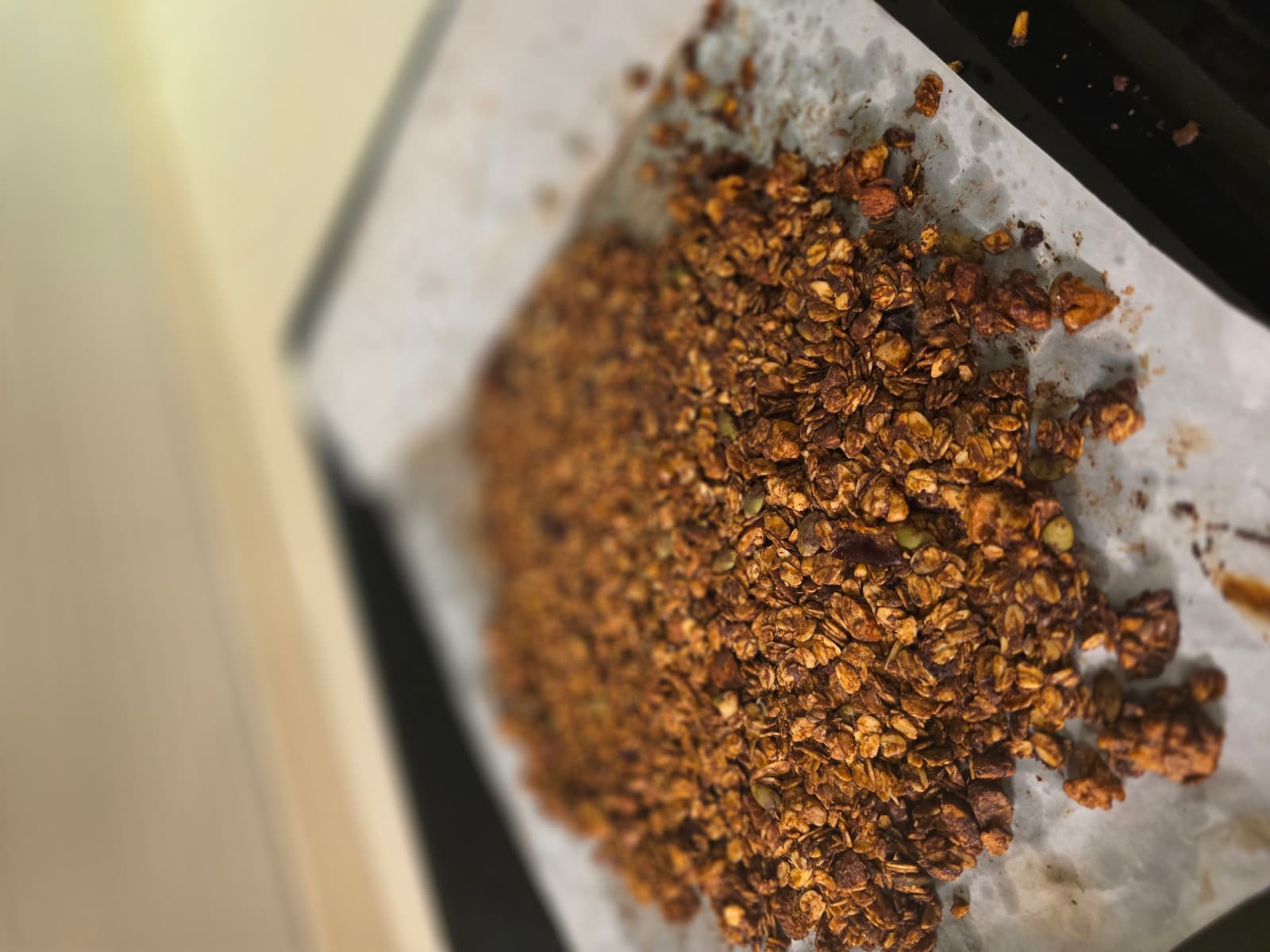 Macro close-up of chocolate granola clusters on parchment